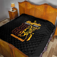 Black quilt blanket on a bed with diamond stitching and gold-and-red Buffalo emblem, 18 61