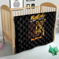 Black quilt blanket with diamond quilting and gold-and-red Buffalo emblem, 18 61 in a crib