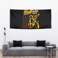 Black Buffalo Soldiers tapestry with gold “18 66” rider design, hanging above sofa.