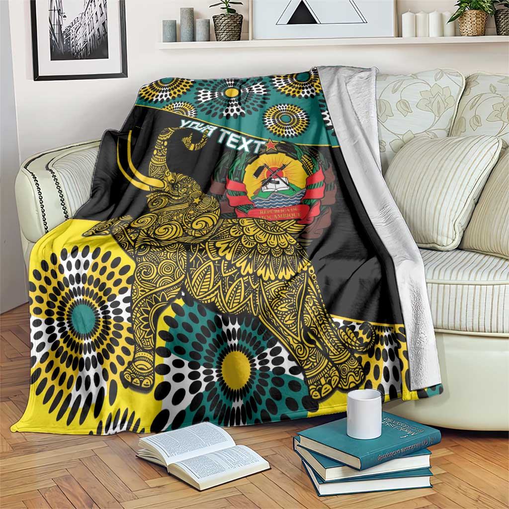 Green and black African elephant blanket with gold pattern and coat-of-arms crest, draped