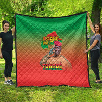 Green and red diamond-quilt blanket with Africa map and 'TRAORE' portrait print.