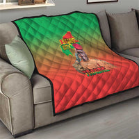 Green and red diamond-stitch quilt blanket with Africa map and 'TRAORE' graphic.