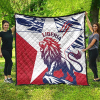 Liberia quilt with lion emblem, red white navy patchwork, laid outdoors