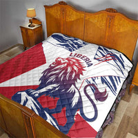 Liberia quilt on bedspread with red, white, and navy lion emblem and geometric flag shapes