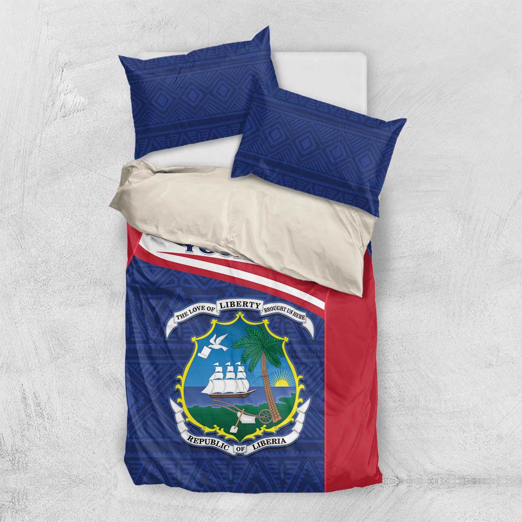 Personalized Liberia bedding set folded view: blue geometric print, red sides, coat of arms.