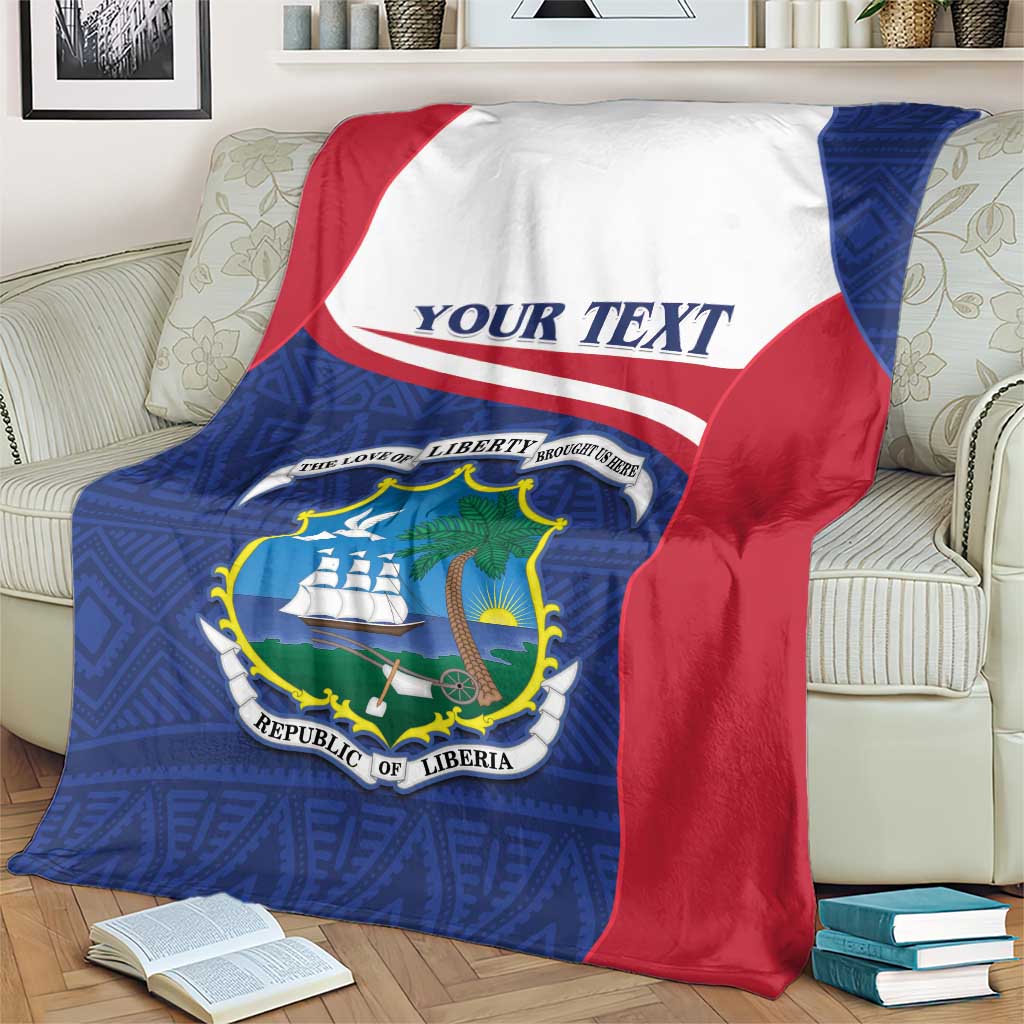 Liberia blanket coat on beige couch with blue front and red-and-white angled corner