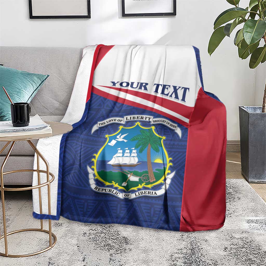 Liberia blanket coat on living room seat, blue blanket with red border and crest
