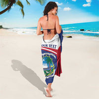 Personalized sarong coat in blue and red with centered Liberia coat-of-arms and 'YOUR TEXT'