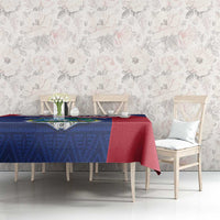 Blue and red Liberia coat of arms tablecloth on dining table with chairs