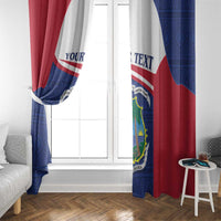 Pair of Liberia coat of arms curtains with custom text, draped by a white window
