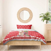 Red Christmas duvet and pillow on wooden bed with alpaca and “Peru” print