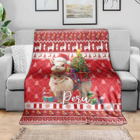 Red Christmas blanket draped on a sofa with alpaca and “Peru” center print