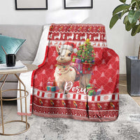 Red Christmas blanket featuring alpaca and “Peru” logo with festive border