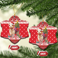 Red snowflake-shaped ceramic ornament set with alpaca and gifts; shows Peru and Feliz Navidad.