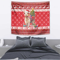 Red Christmas tapestry centered on alpaca holding gifts, Peru lettering, pine tree pattern.