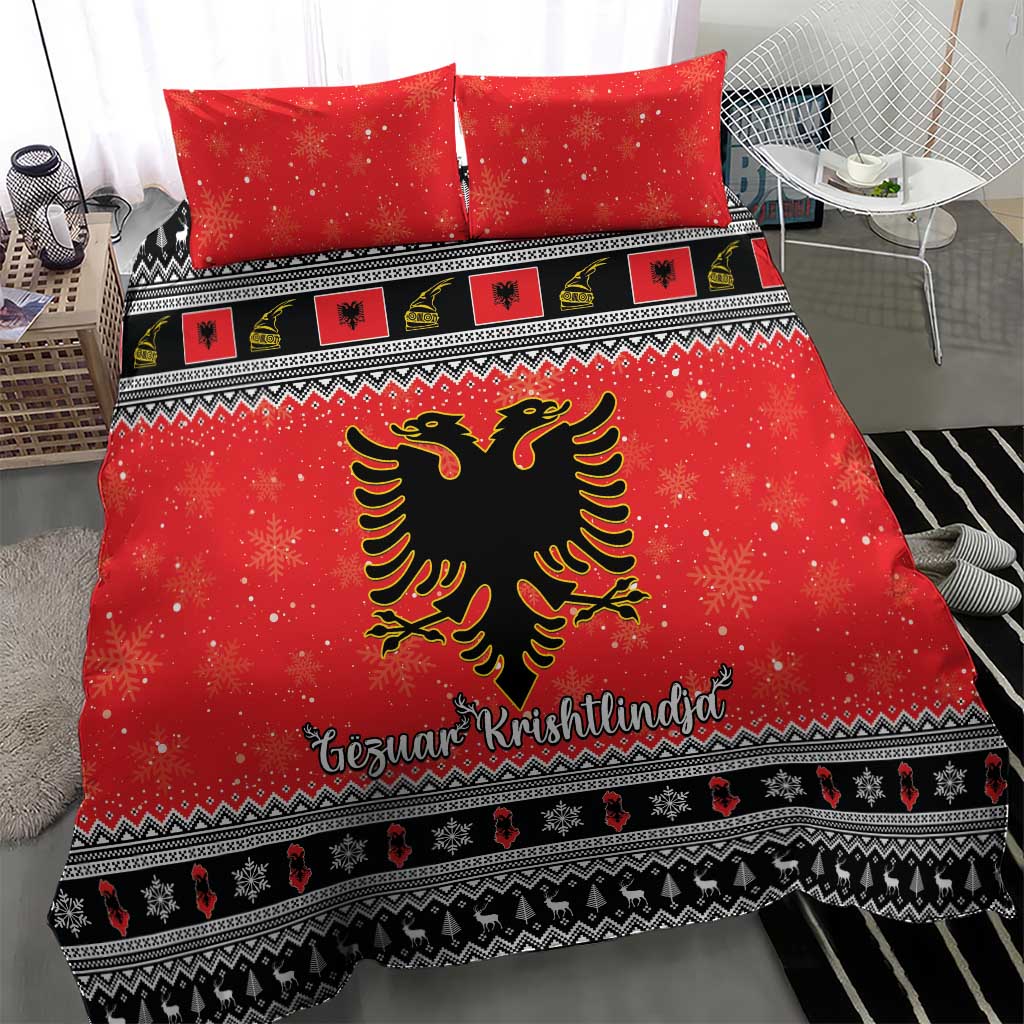 Red duvet and two pillowcases with central black eagle emblem and snowflake accents