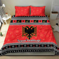 Red bedding set with two pillowcases, eagle emblem and black patterned band along hem