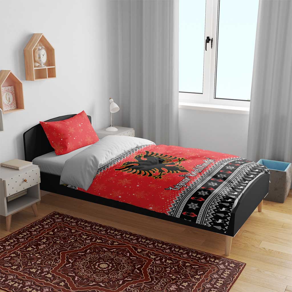 Red duvet cover with eagle design and patterned border, shown with two pillowcases