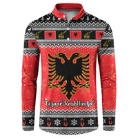 Red and black Christmas button sweatshirt with eagle emblem and festive border pattern
