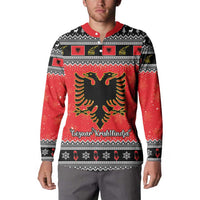 Red and black Christmas button sweatshirt on model, front with eagle emblem and holiday text