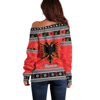 Red off-shoulder Christmas sweater with Albanian eagle graphic and 'Albania' lettering