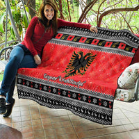 Red quilt blanket with Albanian eagle graphic and black-and-white diamond-trim border