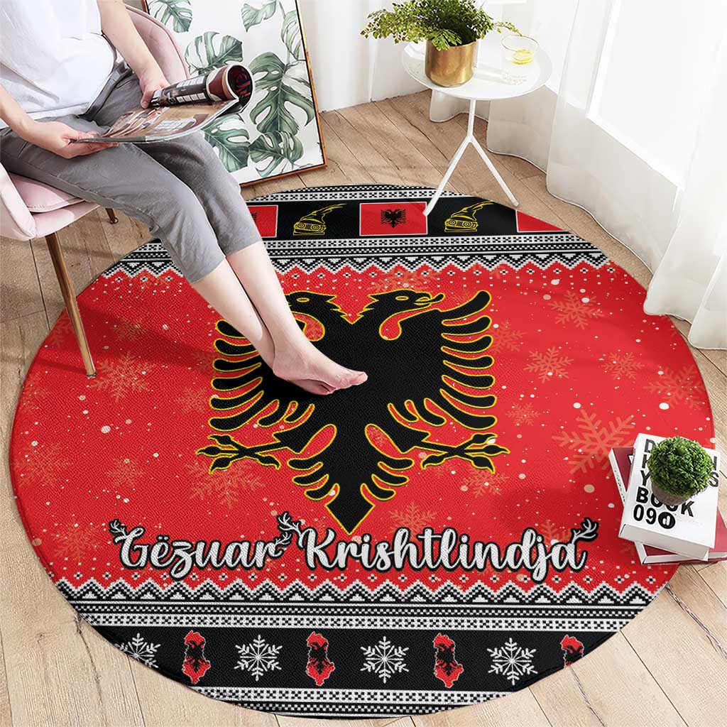 Red round Christmas rug with central black eagle and Gezuar Krishtlindja text