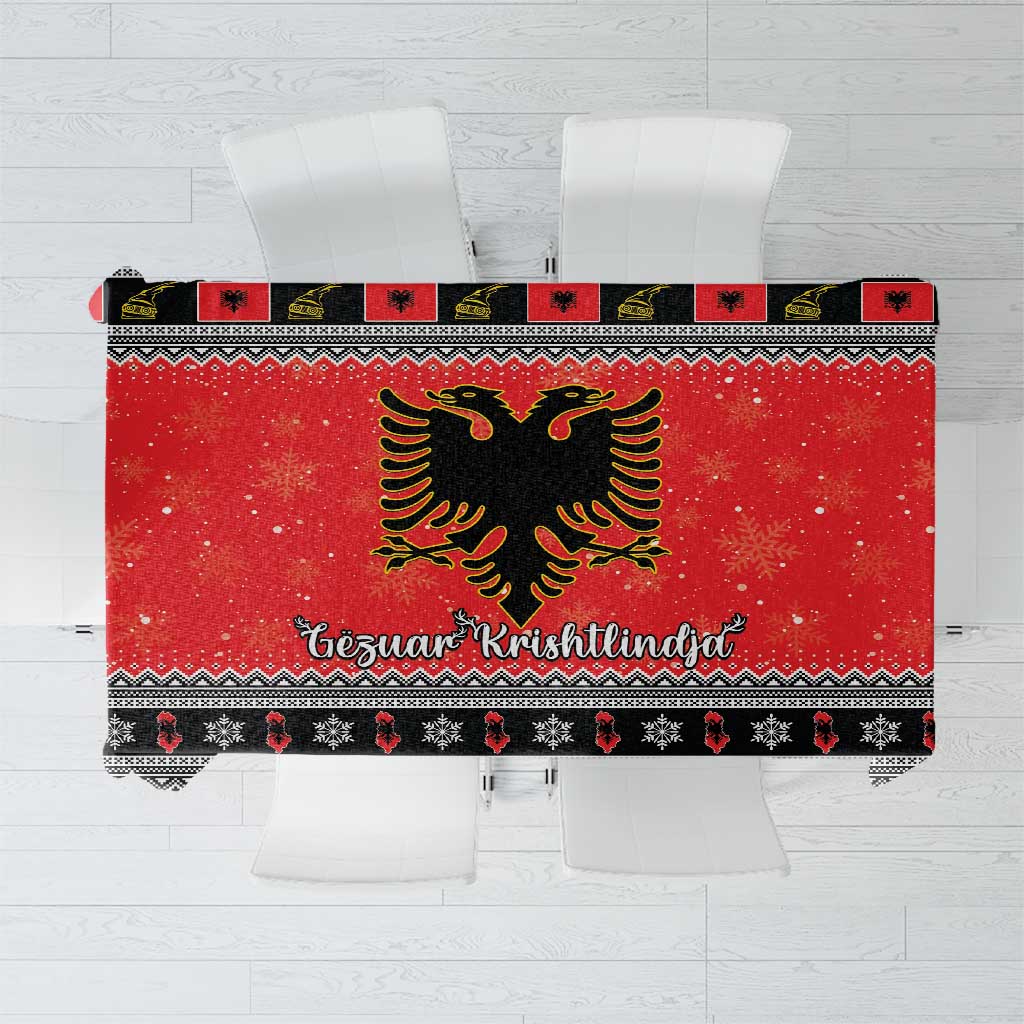 Red Christmas tablecloth with Albanian eagle, geometric trim, and festive lettering band.