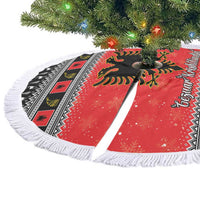Red Christmas tree skirt with Albanian eagle, black geometric trim, and white fringe