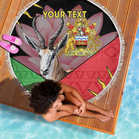 Black circular beach blanket with fringe edge, gazelle and Malawi crest, 'YOUR TEXT'.