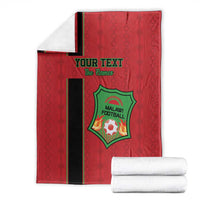 Red football blanket set with black stripe and green crest logo, custom text and rolled towels.