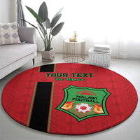 Round red football carpet with central green Malawi Football crest and black side stripe