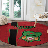 Round red football carpet with green Malawi Football logo, black diagonal stripe, flame text