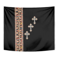 Close-up black tapestry with patterned left panel and four silver-tone crosses.