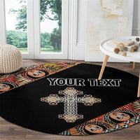 Black round carpet with gold cross and angel face border, custom text