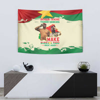 Wall tapestry hung above a console, featuring flag colors with portraits and bold slogan
