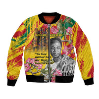 Yellow bomber jacket with portrait, flowers, and 'We face...' quote; black ribbed trim