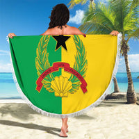 Round beach blanket with Guinea-Bissau flag print held open, white fringed border