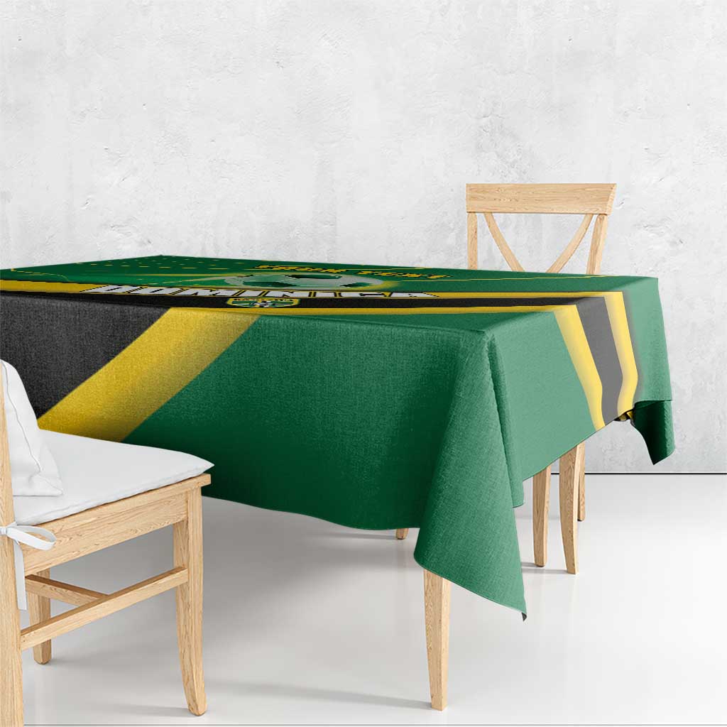 Green football tablecloth draped over dining table with yellow and black graphics