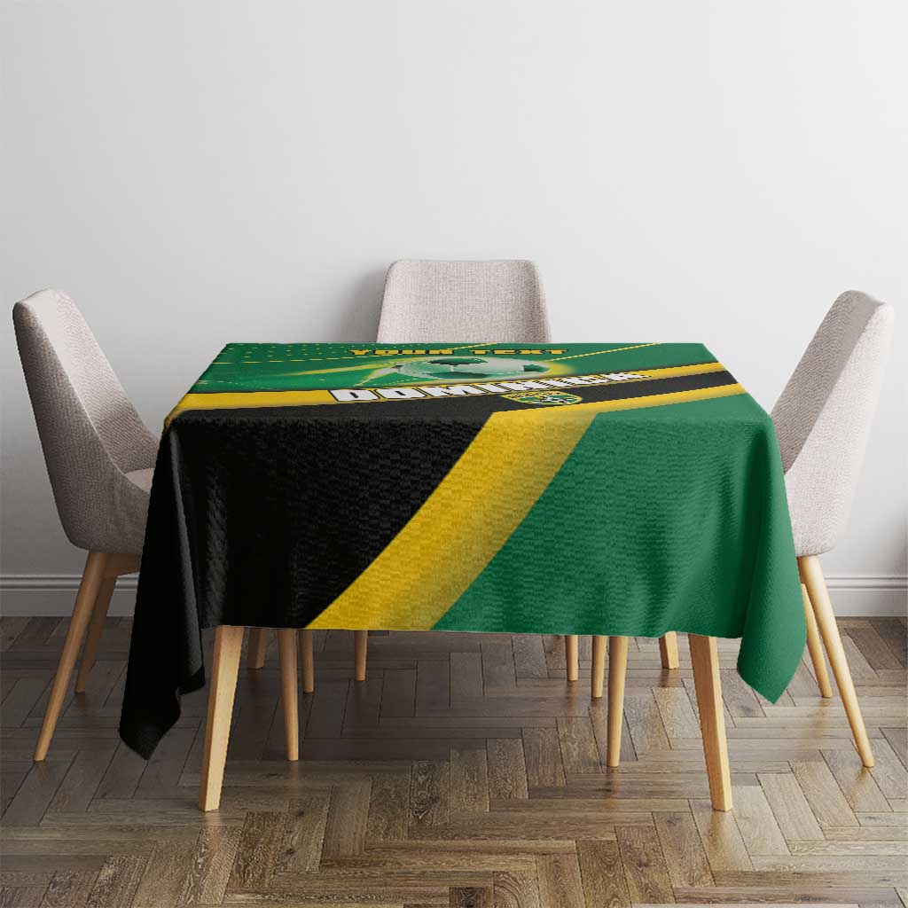 Green football tablecloth with yellow stripe and black panel across the table