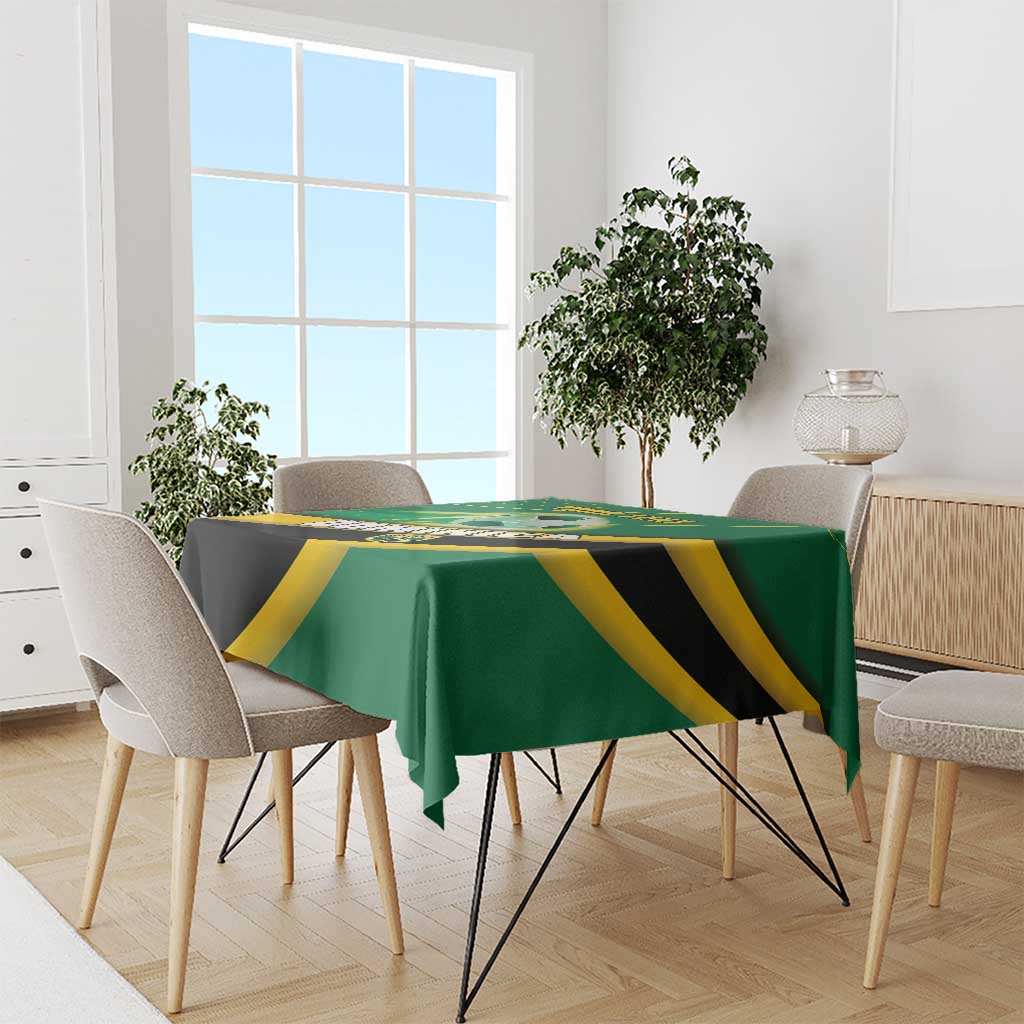 Green football tablecloth covering dining table with yellow and black team-style print