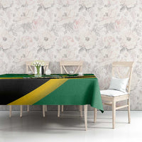 Green football tablecloth on table with yellow diagonal stripes and black band