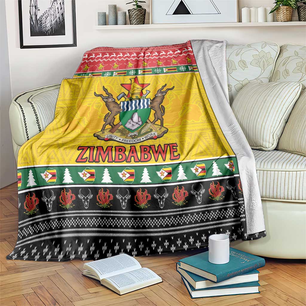 Zimbabwe Christmas blanket with yellow, red, and black coat of arms design