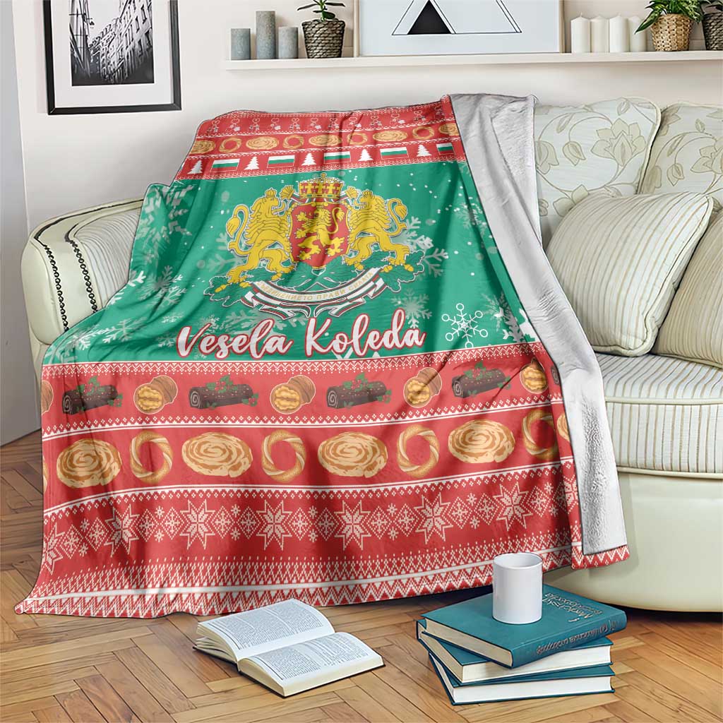 Green Christmas blanket with red border, coat of arms, snowflakes, and Vesela Koleda text