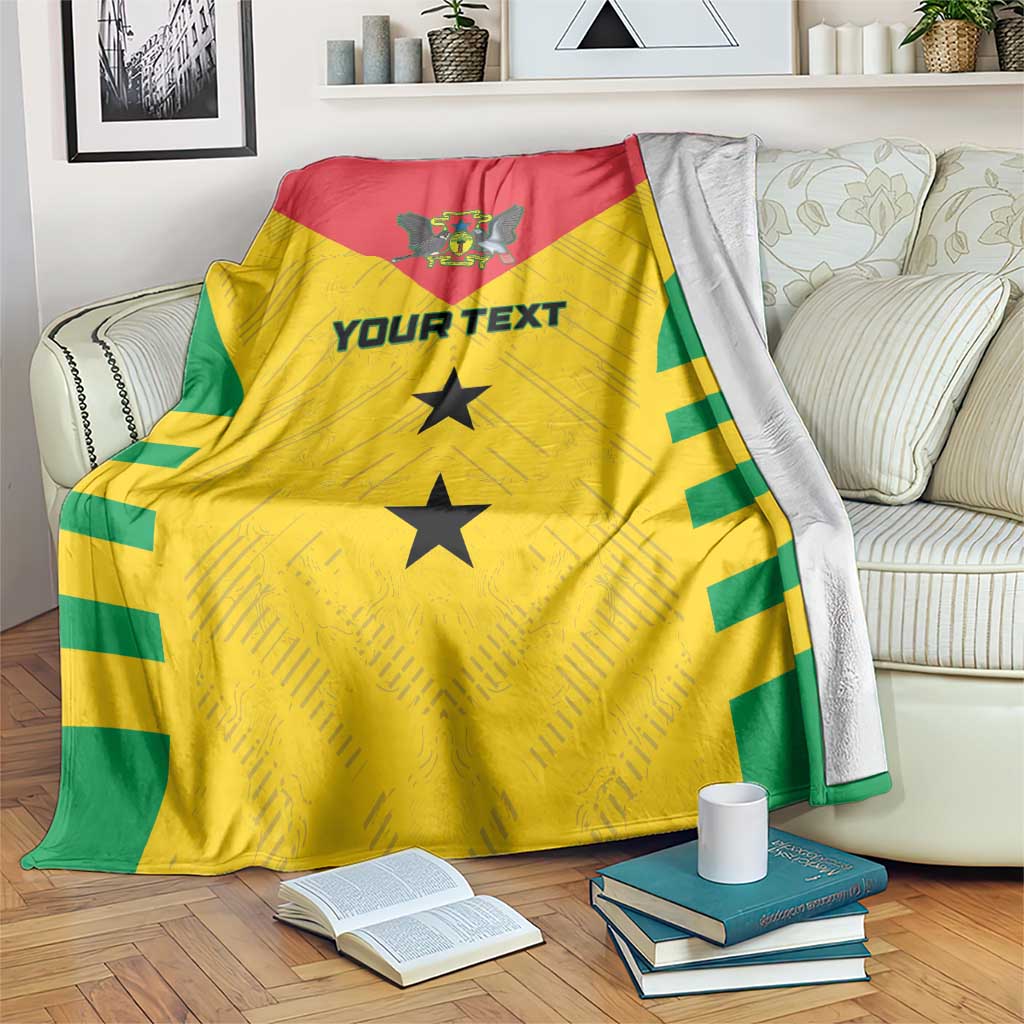 Yellow football blanket with red and green sections, crest, and two black stars.
