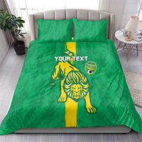 Green bedding set with lion mascot graphic, shield emblem, and yellow center stripe