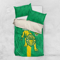 Green duvet cover set with lion graphic and yellow stripe; two green pillowcases