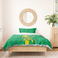 Green bedding set with lion and shield design on duvet, shown with pillow and bed frame
