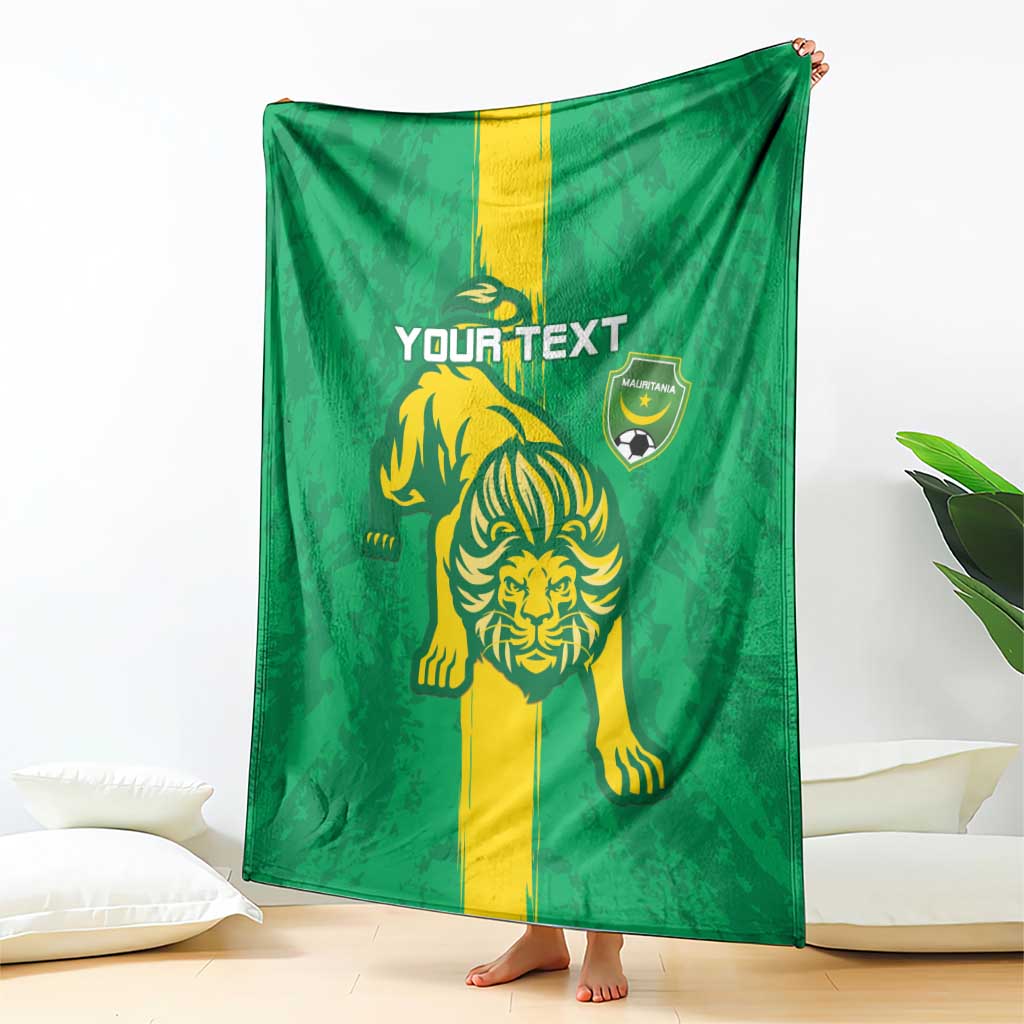 Green football blanket with yellow lion graphic and shield emblem, hanging display