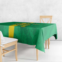 Green football tablecloth with yellow vertical stripe and detailed crest